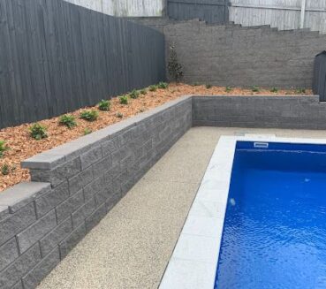 Residential Pool Side Landscaping with Landscape plant bed at CLM Group Landscaping & Maintenance Services